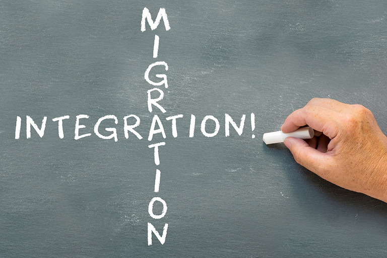 Kreidetafel mit der Beschriftung Integration und Migration